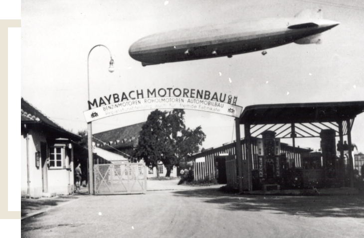 The entrance to Maybach Engine Works with a Zeppelin airship in the sky, 1930s